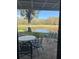 Covered patio with seating overlooking a tranquil pond at 4774 Fox Hunt Dr # C115 &C113, Wesley Chapel, FL 33543