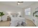 Bright bedroom with a queen-size bed and neutral decor at 6400 46Th N Ave # 8, Kenneth City, FL 33709