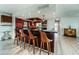 Modern kitchen with stainless steel appliances and dark wood cabinets at 302 Lagoon Dr, Palm Harbor, FL 34683