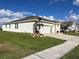 Home exterior showcasing the side and garage at 1027 Ocean Spray Dr, Ruskin, FL 33570