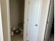 Small bathroom with toilet and grab bar at 1027 Ocean Spray Dr, Ruskin, FL 33570