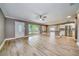 Spacious living room with hardwood floors and large windows at 1807 Sunrise Blvd, Clearwater, FL 33760