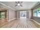 Bright living room with French doors leading to a sunroom at 1807 Sunrise Blvd, Clearwater, FL 33760