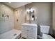 Clean bathroom with updated vanity and a walk-in shower at 1807 Sunrise Blvd, Clearwater, FL 33760