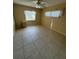 Bright bedroom with tile floors and ample natural light at 1427 Normandy Park Dr # 1, Clearwater, FL 33756