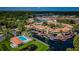 An aerial view of a waterfront condominium complex with a pool and boat docks at 2571 Cyprus Dr # 1-202, Palm Harbor, FL 34684