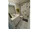 Clean bathroom featuring a vanity, toilet, and shower with a decorative curtain, offering a functional space at 2571 Cyprus Dr # 1-202, Palm Harbor, FL 34684