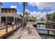 Scenic waterfront view with private boat dock access, ideal for boating enthusiasts at 2571 Cyprus Dr # 1-202, Palm Harbor, FL 34684