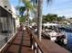 Dockside view with boats and palm trees at 2571 Cyprus Dr # 1-202, Palm Harbor, FL 34684
