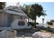 Welcome to Sunset Beach, featuring a well-maintained entrance with lush greenery at 2571 Cyprus Dr # 1-202, Palm Harbor, FL 34684