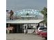 Iconic 'Tarpon Springs, Florida' sign above the 'Dolphin Gift Shop' with ample parking space at 2571 Cyprus Dr # 1-202, Palm Harbor, FL 34684