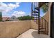 Outdoor spiral staircase with a blue sky background in a beautiful residential neighborhood setting at 2571 Cyprus Dr # 1-202, Palm Harbor, FL 34684