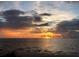 Beautiful sunset over the ocean with vibrant colors and reflective waters, perfect for relaxing evenings at 2571 Cyprus Dr # 1-202, Palm Harbor, FL 34684