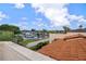 Waterfront views of a canal and boat storage with commercial signage at 2571 Cyprus Dr # 1-202, Palm Harbor, FL 34684
