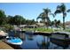 Waterfront view featuring several boats docked along the canal at 2571 Cyprus Dr # 1-202, Palm Harbor, FL 34684