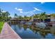 Waterfront view with condos and several boats along the docks at 2571 Cyprus Dr # 1-202, Palm Harbor, FL 34684