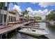 Beautiful waterfront community with boat docks, palm trees, and stunning architecture offering a serene and luxurious lifestyle at 2571 Cyprus Dr # 1-202, Palm Harbor, FL 34684