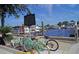 Picturesque waterfront featuring docked boats and vintage bicycles, offering a glimpse of tranquil coastal living at 2571 Cyprus Dr # 1-202, Palm Harbor, FL 34684