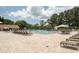 Large community pool with plenty of lounge chairs at 2740 Whitebridge Dr # A, Palm Harbor, FL 34684