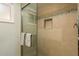 Modern bathroom with tiled shower and glass door at 620 Edgewater Dr # 304, Dunedin, FL 34698