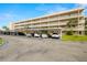 Exterior view of building with covered parking and landscaping at 9950 62Nd N Ter # 106, St Petersburg, FL 33708