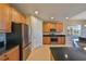 Modern kitchen with stainless steel appliances and granite countertops at 1357 Emerald Dunes Dr, Sun City Center, FL 33573