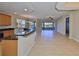 Open concept kitchen with granite counters and breakfast bar at 1357 Emerald Dunes Dr, Sun City Center, FL 33573