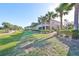 Building exterior showcasing landscaping and golf course views at 1357 Emerald Dunes Dr, Sun City Center, FL 33573