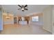 Open living space with tile floors and ceiling fan at 1357 Emerald Dunes Dr, Sun City Center, FL 33573
