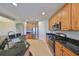 Modern kitchen with stainless steel appliances and granite countertops at 1357 Emerald Dunes Dr, Sun City Center, FL 33573