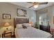Bedroom with ceiling fan, wood flooring, and a dresser at 1357 Emerald Dunes Dr, Sun City Center, FL 33573