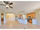 Open living room with kitchen and breakfast bar views at 1357 Emerald Dunes Dr, Sun City Center, FL 33573