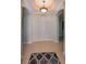 Bright entryway with tile flooring and decorative rug at 1357 Emerald Dunes Dr, Sun City Center, FL 33573