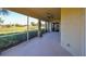Screened patio with golf course view and ceiling fan at 1357 Emerald Dunes Dr, Sun City Center, FL 33573