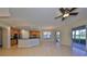 Open concept kitchen with island and stainless steel appliances at 1357 Emerald Dunes Dr, Sun City Center, FL 33573