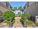 Private patio area with walkway and landscaping at 1357 Emerald Dunes Dr, Sun City Center, FL 33573