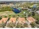 Aerial view of community with golf course at 1357 Emerald Dunes Dr, Sun City Center, FL 33573