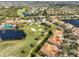 Aerial view showcasing community location near golf course and lake at 1357 Emerald Dunes Dr, Sun City Center, FL 33573
