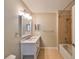 Clean bathroom with white vanity, quartz countertop, and shower/tub at 1357 Emerald Dunes Dr, Sun City Center, FL 33573