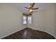 Bright bedroom with wood flooring, ceiling fan, and large windows at 1357 Emerald Dunes Dr, Sun City Center, FL 33573