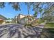 Townhouse with driveway and lush landscaping at 1357 Emerald Dunes Dr, Sun City Center, FL 33573