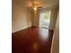 Bedroom with hardwood floors and sliding door to balcony at 18001 Richmond Place Dr # 425, Tampa, FL 33647