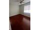 Spacious bedroom with hardwood floors and ceiling fan at 18001 Richmond Place Dr # 425, Tampa, FL 33647
