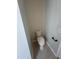 Small half bathroom with toilet and pedestal sink at 18001 Richmond Place Dr # 425, Tampa, FL 33647
