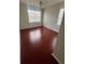 Bedroom with hardwood floors and large window at 18001 Richmond Place Dr # 425, Tampa, FL 33647