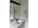 Modern bathroom vanity with white countertop and black fixtures at 18001 Richmond Place Dr # 425, Tampa, FL 33647