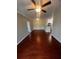 Living room with hardwood floors and ceiling fan at 18001 Richmond Place Dr # 425, Tampa, FL 33647