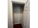 Walk-in closet with wood flooring and shelving at 18001 Richmond Place Dr # 425, Tampa, FL 33647