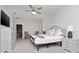 Spacious bedroom with king-size bed, dresser, and ceiling fan at 18620 Rococo Rd, Spring Hill, FL 34610