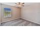 Spacious bedroom with a window offering a view and carpet flooring at 21834 Adriatic Ln, Land O Lakes, FL 34637